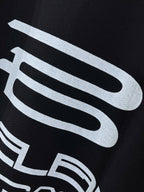 Balenciaga black graphic T-shirt close-up of large white logo print