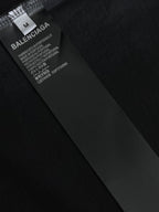 Black fabric label on T-shirt tag with BALENCIAGA and care text