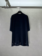 Short-sleeve T-shirt in dark navy/black with distressed speckled hem, no visible front print