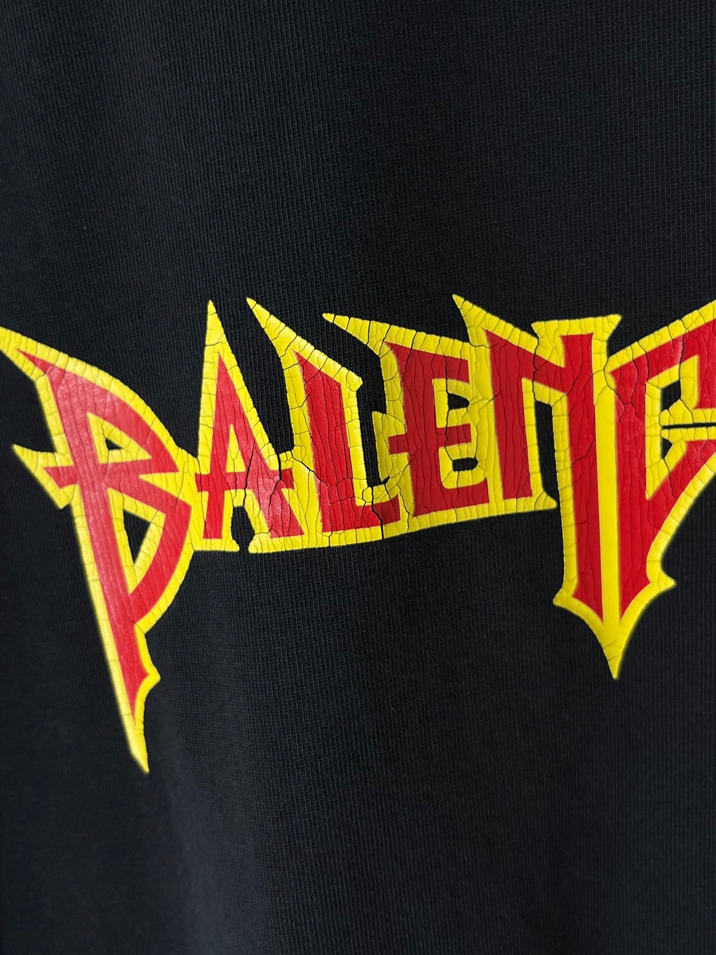 Short-sleeve T-shirt close-up of large Balenciaga logo print in bright colors