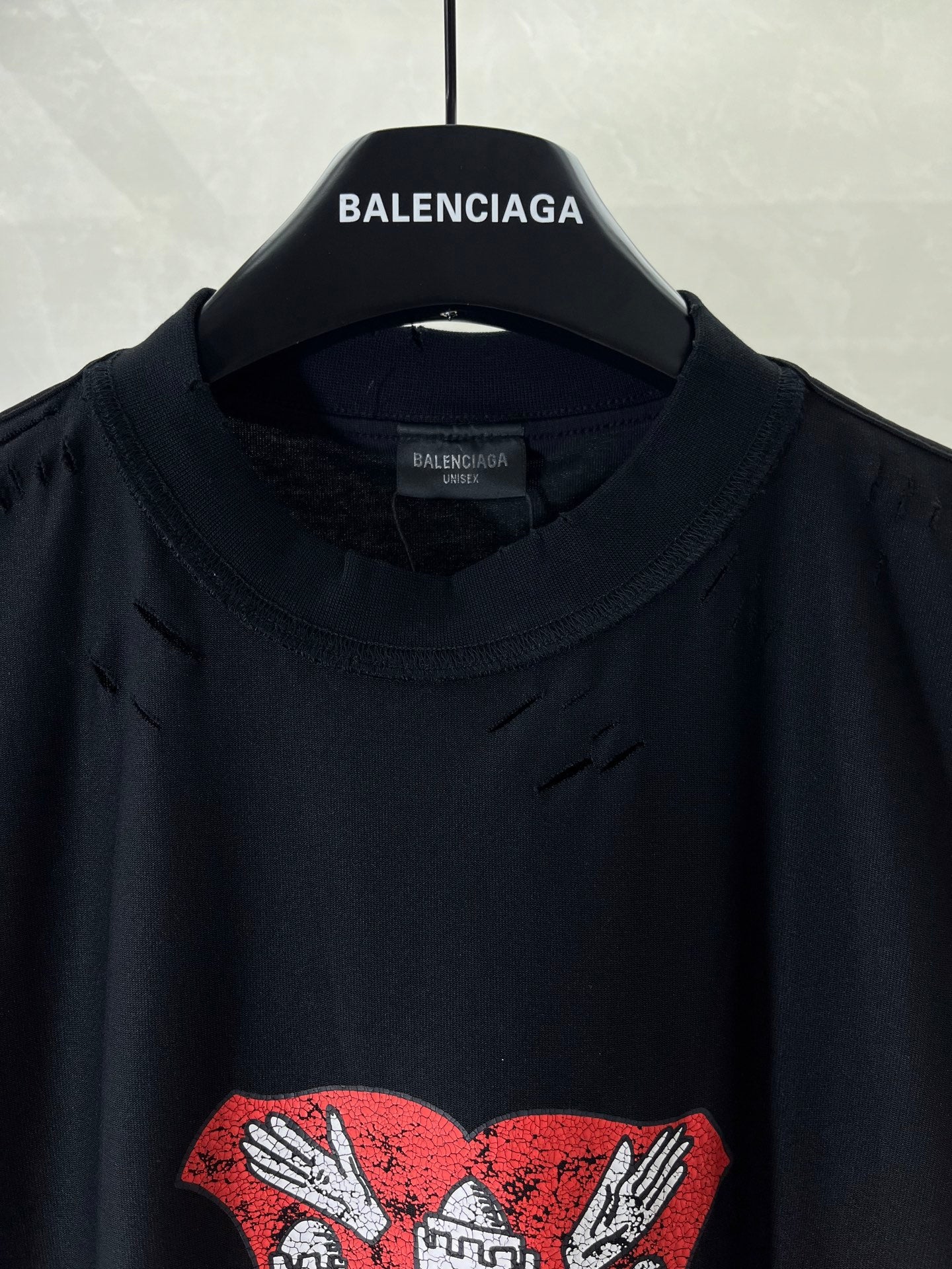 Balenciaga black crewneck T-shirt with red-and-white crest graphic