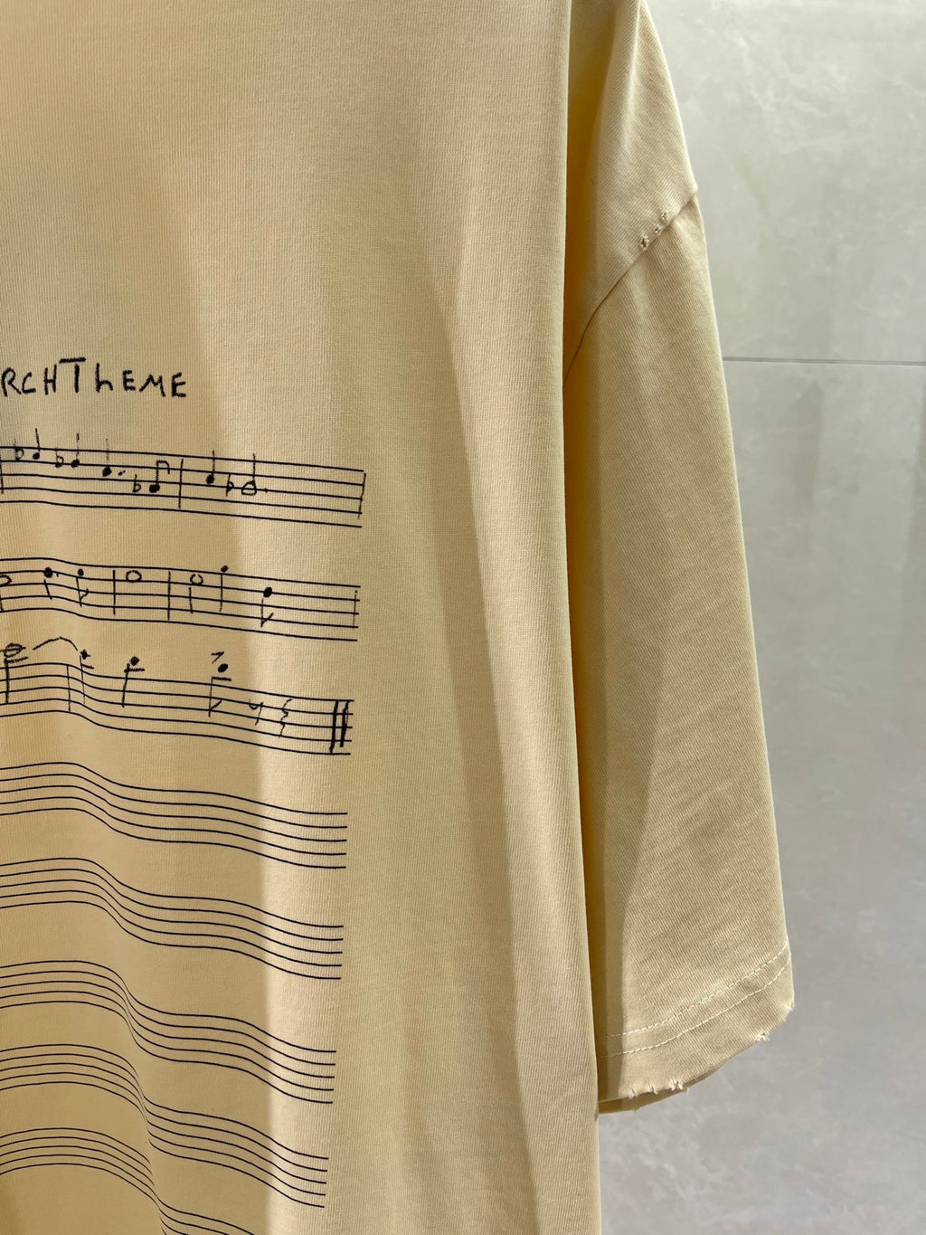 Balenciaga cream T-shirt fabric with partial musical print on front