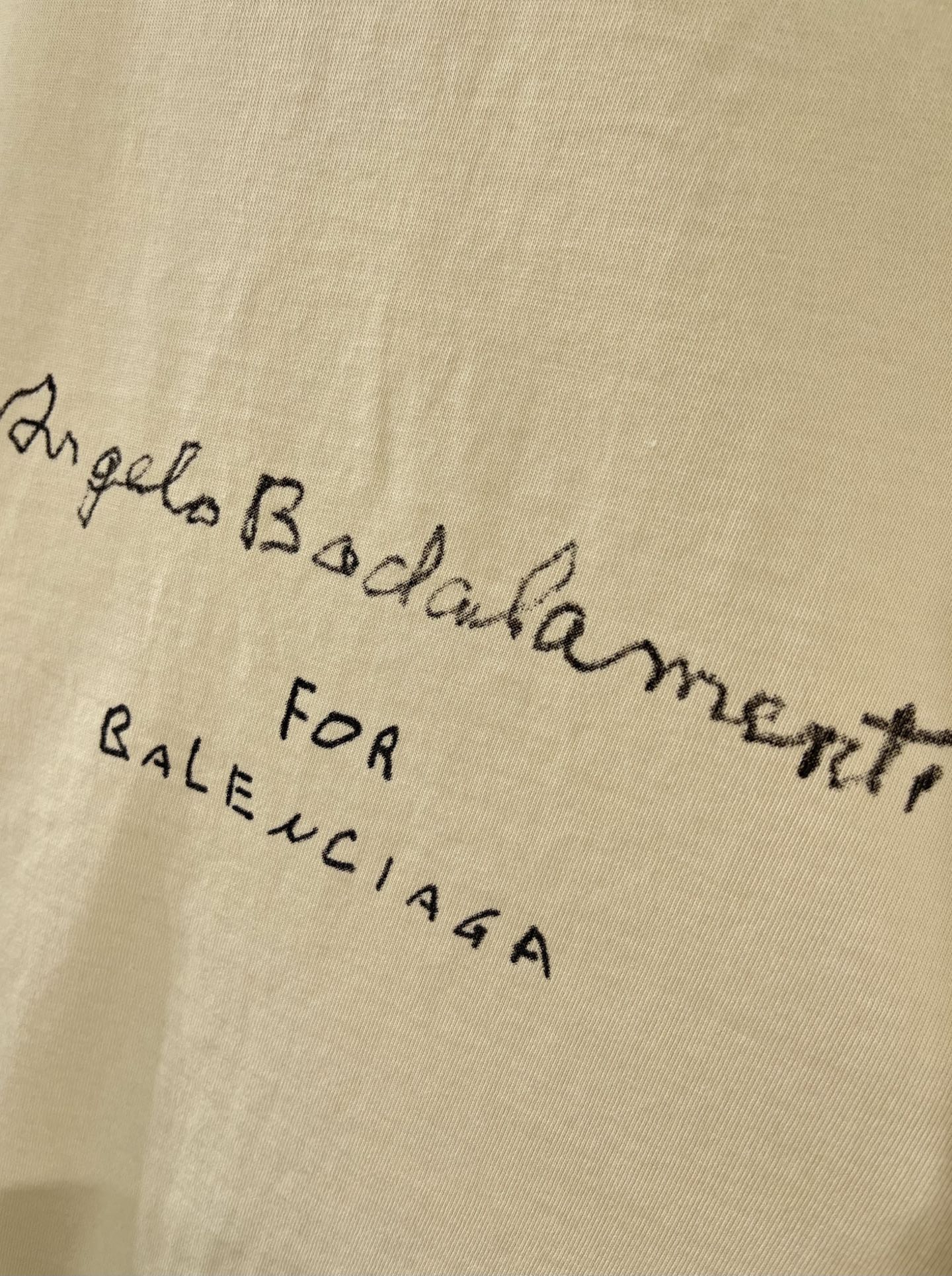 Balenciaga cream T-shirt close-up of cursive and small text graphic