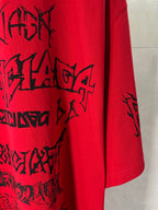 Red T-shirt side hem with black graphic print on the front