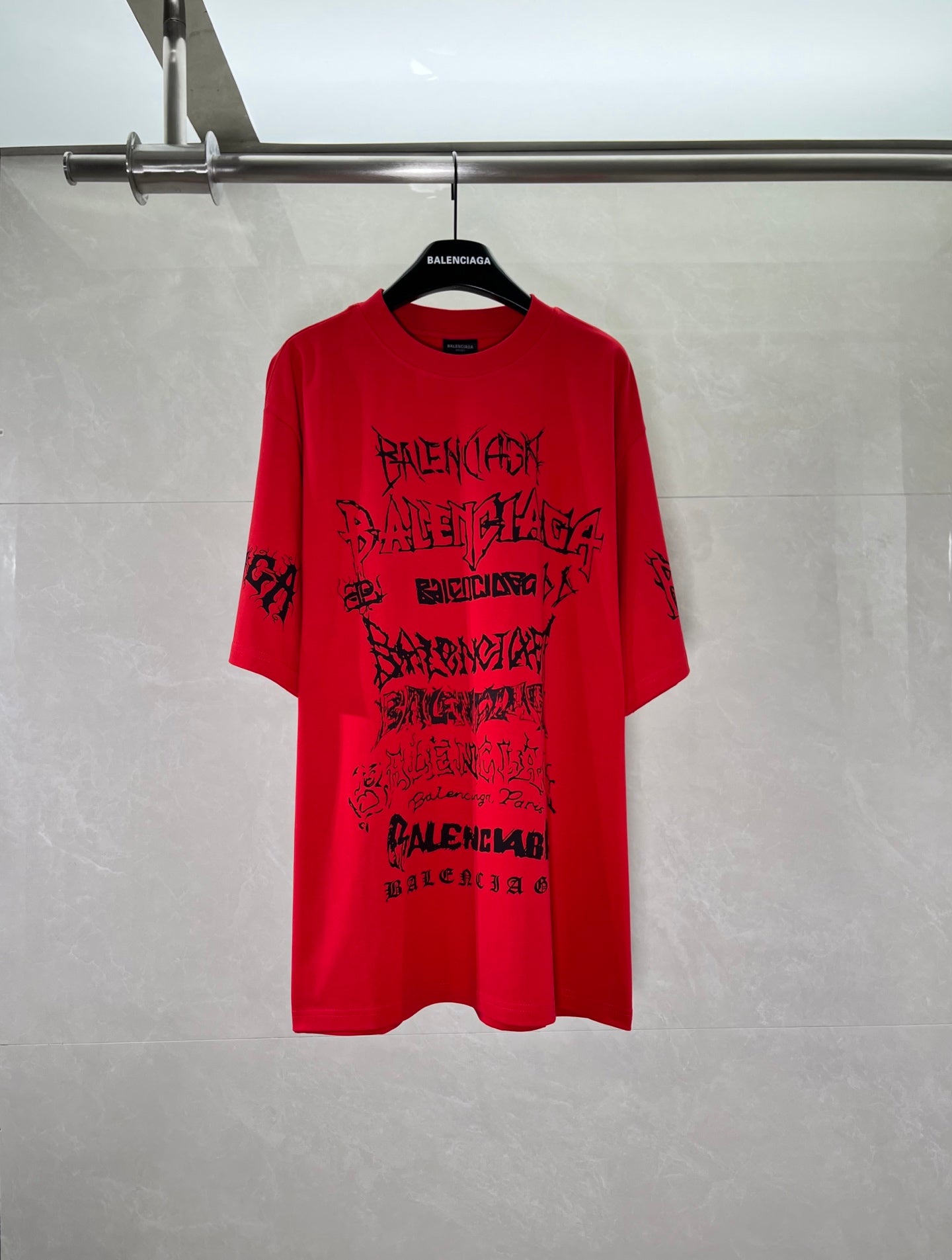 Red crew-neck T-shirt with large black graphic print on the front