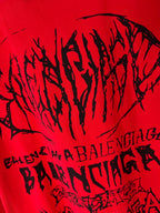 Red T-shirt close-up with large black graphic wordmark text