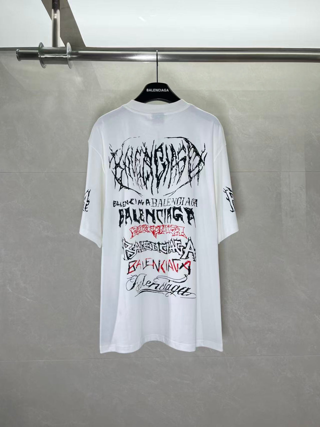 White graphic T-shirt with large Balenciaga text and logo print on back, crew neck
