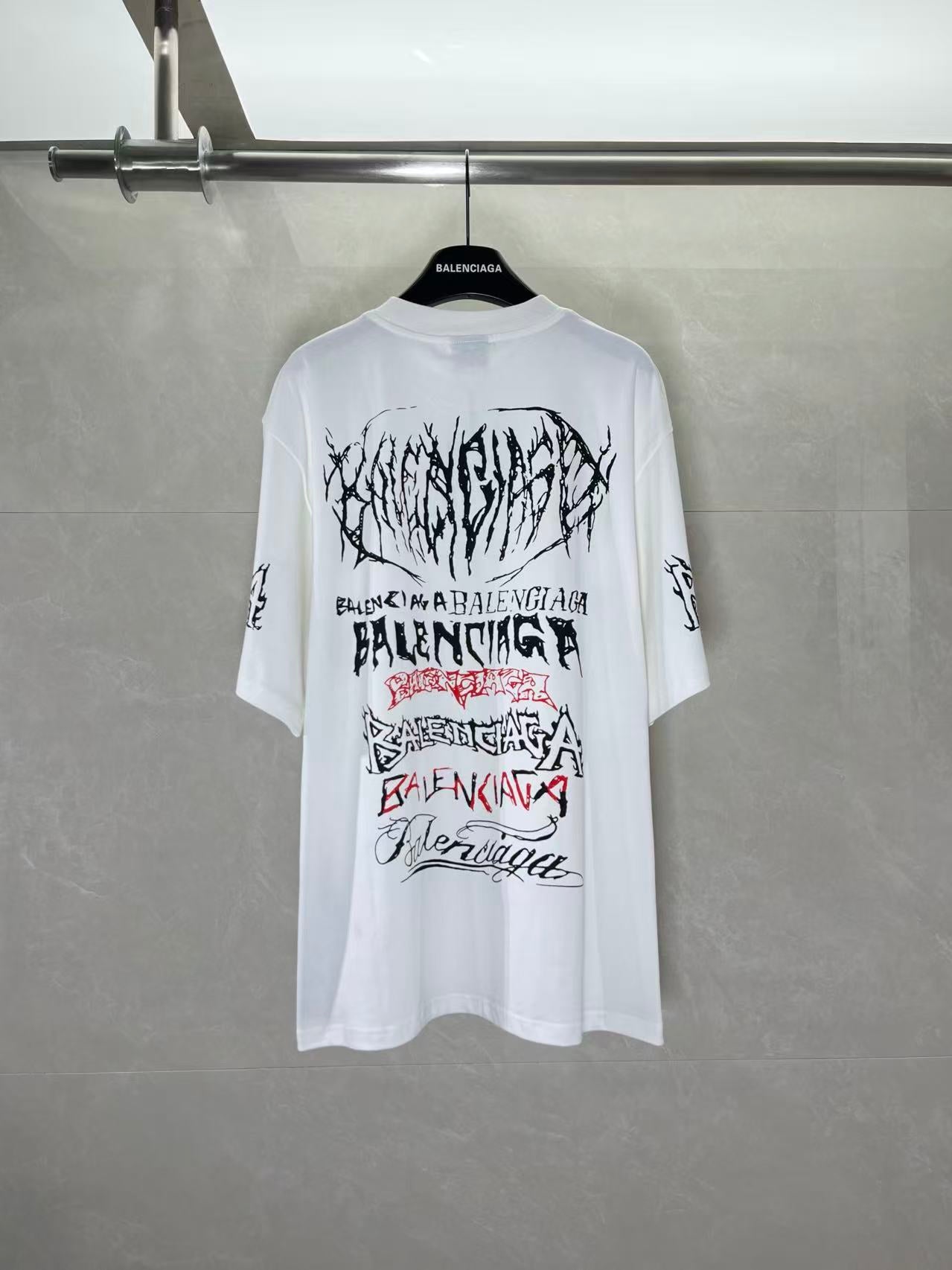 White graphic T-shirt with large Balenciaga text and logo print on back, crew neck