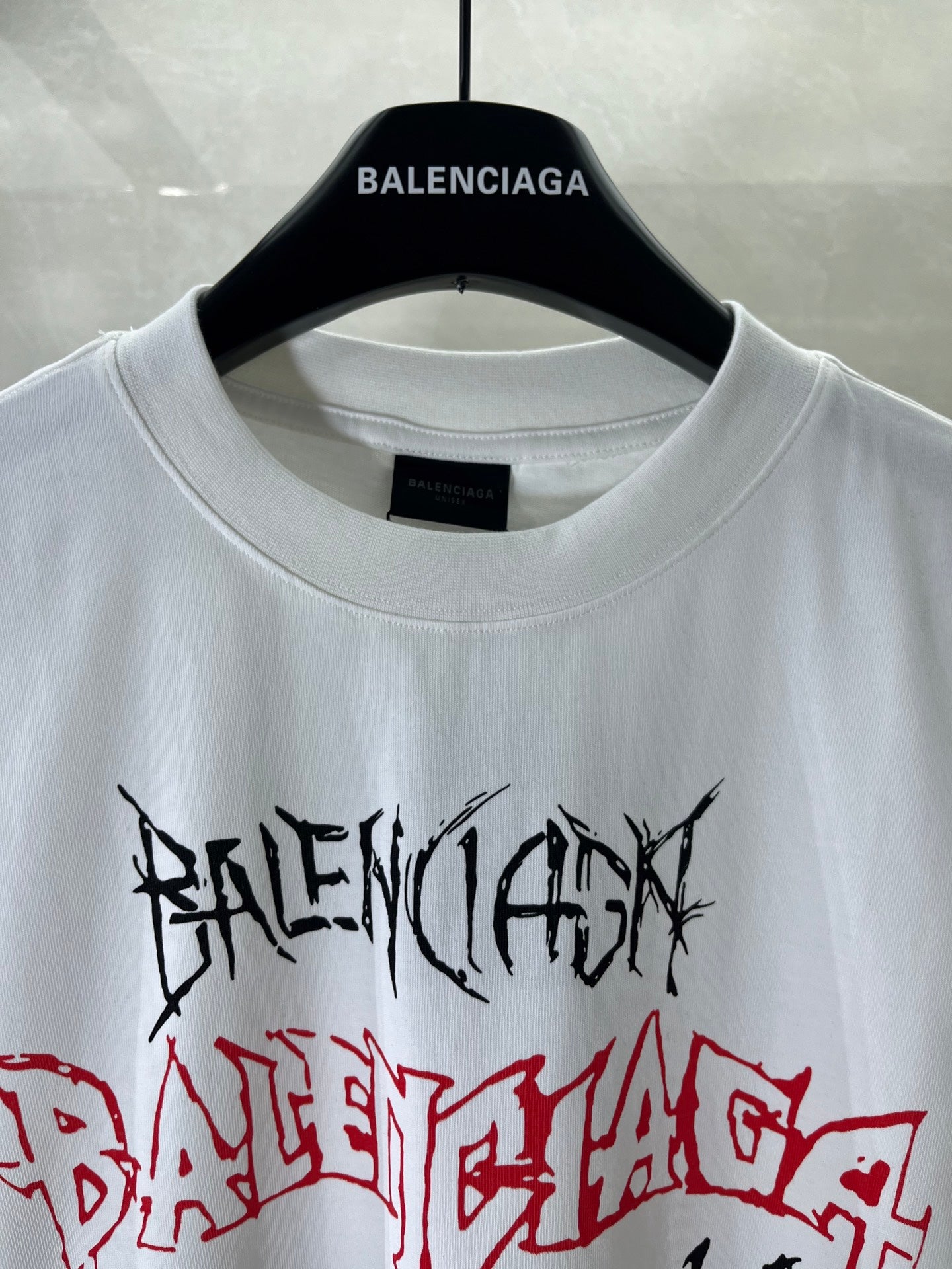 White crew-neck T-shirt with Balenciaga neck label and black/red graphic print