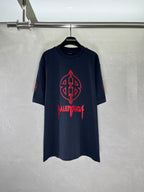Graphic T-shirt with red front emblem, dark navy crew neck.