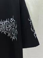 Black short-sleeve shirt with white emblem graphic and angled sleeve