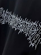 Black shirt with white ornate text-style graphic across chest