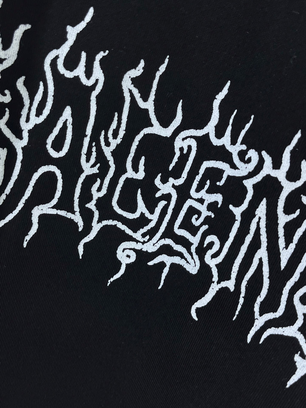 Black fabric with white drip-style logo graphic detail