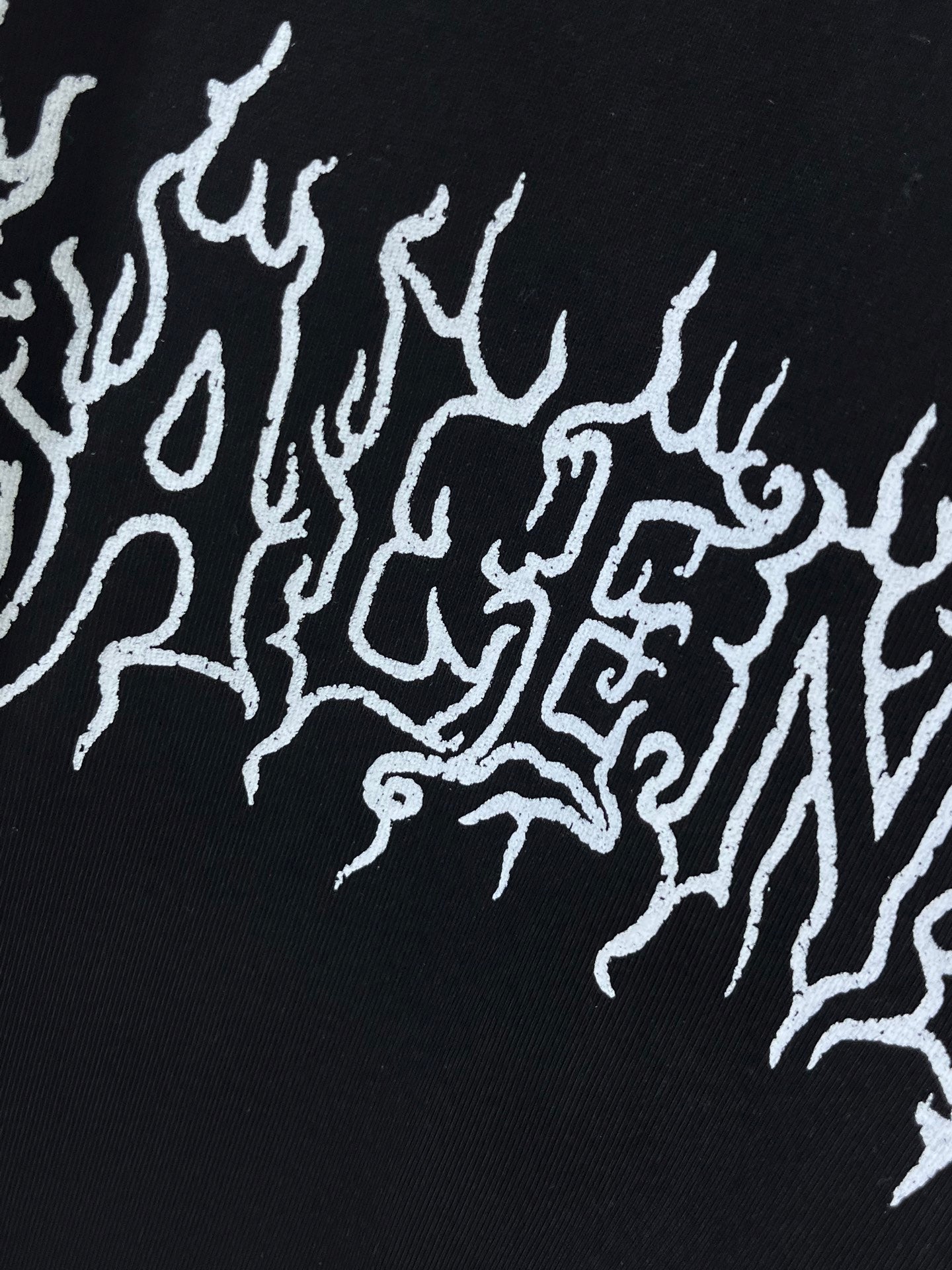 Black fabric with white drip-style logo graphic detail