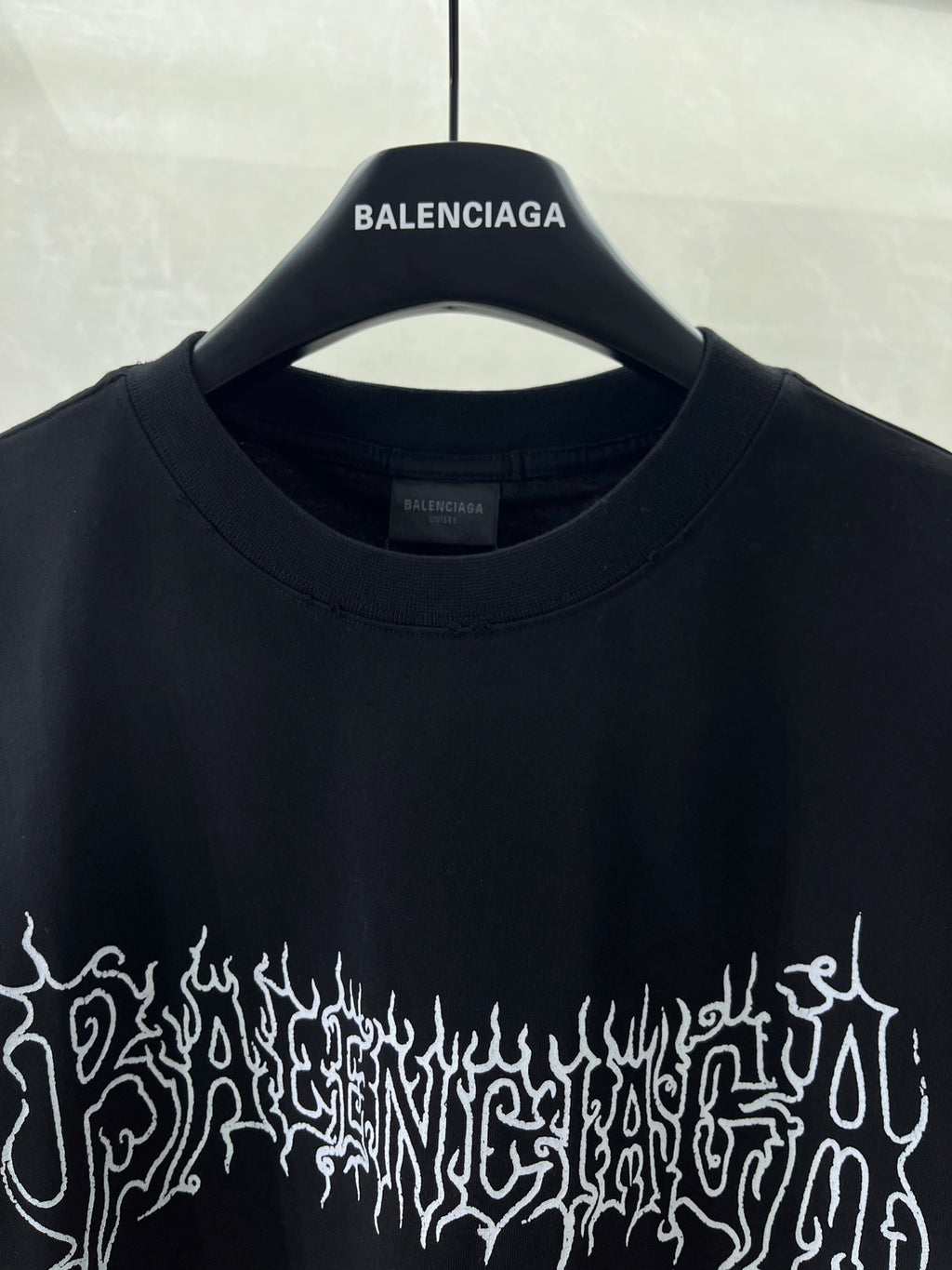 Black short-sleeve shirt, crew neck and small Balenciaga logo
