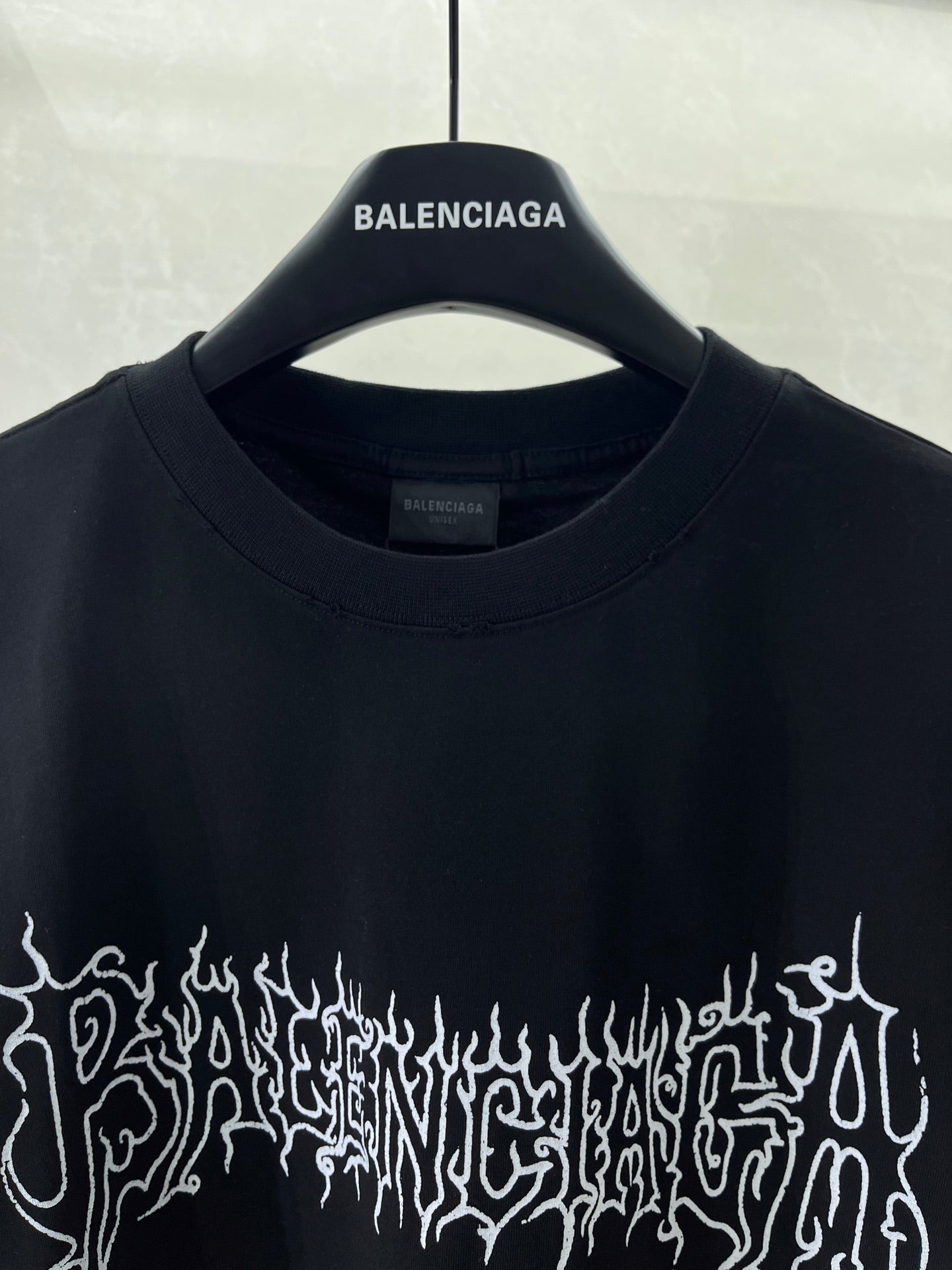 Black short-sleeve shirt, crew neck and small Balenciaga logo