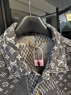 Louis Vuitton denim jacket close-up of check yoke and monogram collar, gold buttons