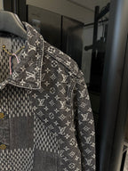 Louis Vuitton denim jacket side view with monogram print and gold button placket