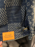 Louis Vuitton monogram denim jacket hem with orange Louis Vuitton brand patch