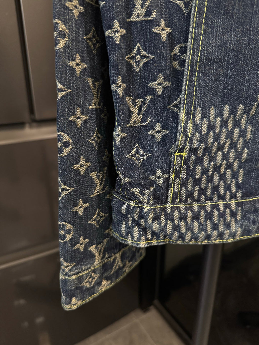 Louis Vuitton monogram denim jacket pocket and cuff detail with contrast seams