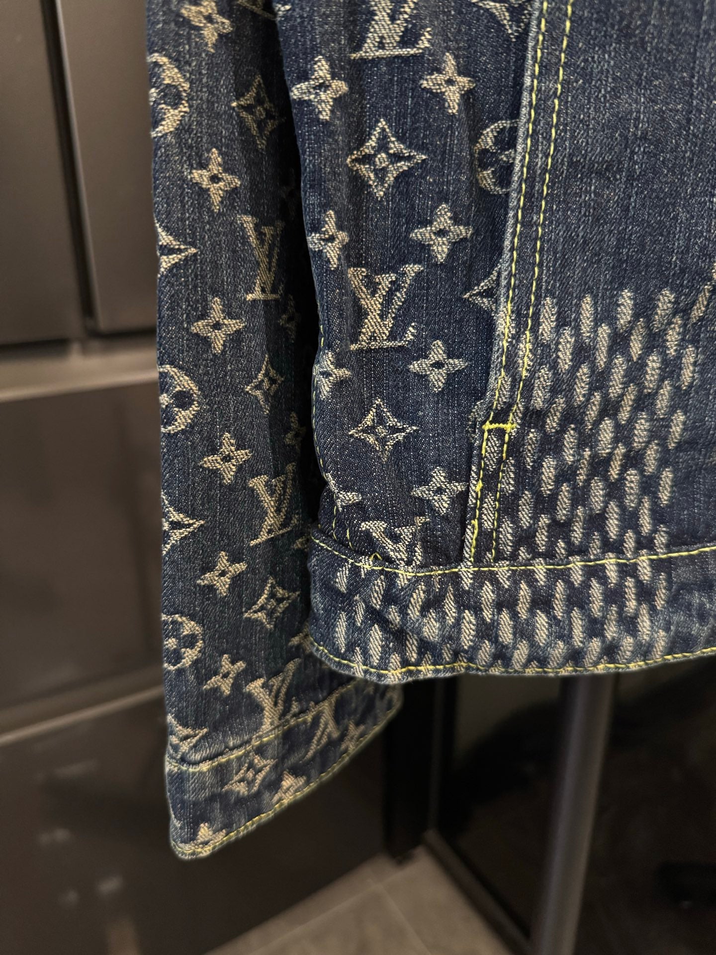 Louis Vuitton monogram denim jacket pocket and cuff detail with contrast seams