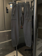 Stone Island cargo trousers, dark gray, front view on hanger with drawstring and multiple pockets