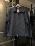 Dark navy long-sleeve jacket with pointed collar and front zip closure