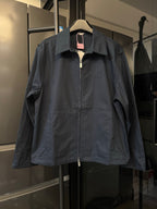 Dark navy long-sleeve jacket with pointed collar and front zip closure