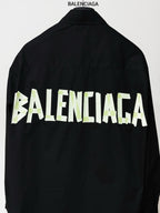 Balenciaga black back button-up shirt with large neon green BALENCIAGA lettering
