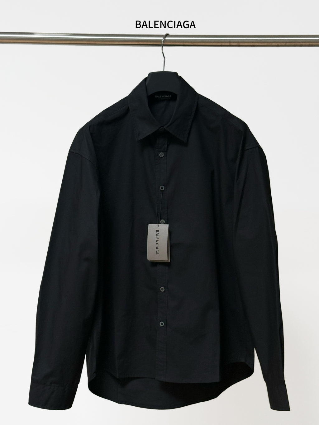 Balenciaga black long-sleeve button-up shirt with pointed collar and front buttons