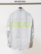 White long-sleeve button-up shirt, back view with neon green logo-style text