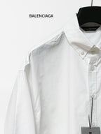 White button-up shirt close-up of pointed collar, front buttons and chest