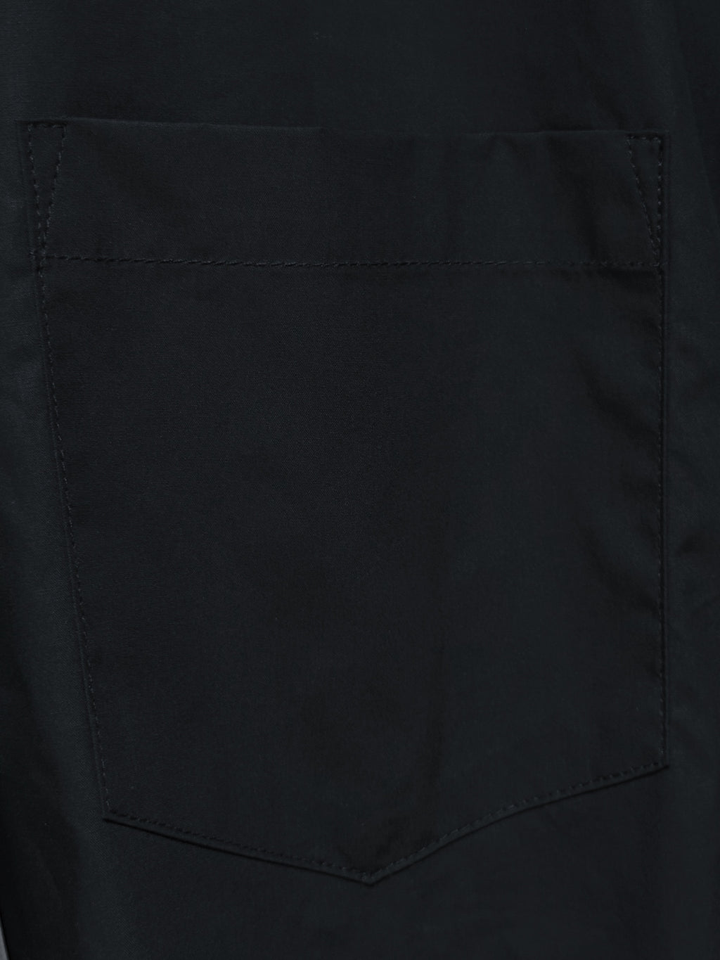 Balenciaga black chest pocket with stitched edges on a long-sleeve shirt