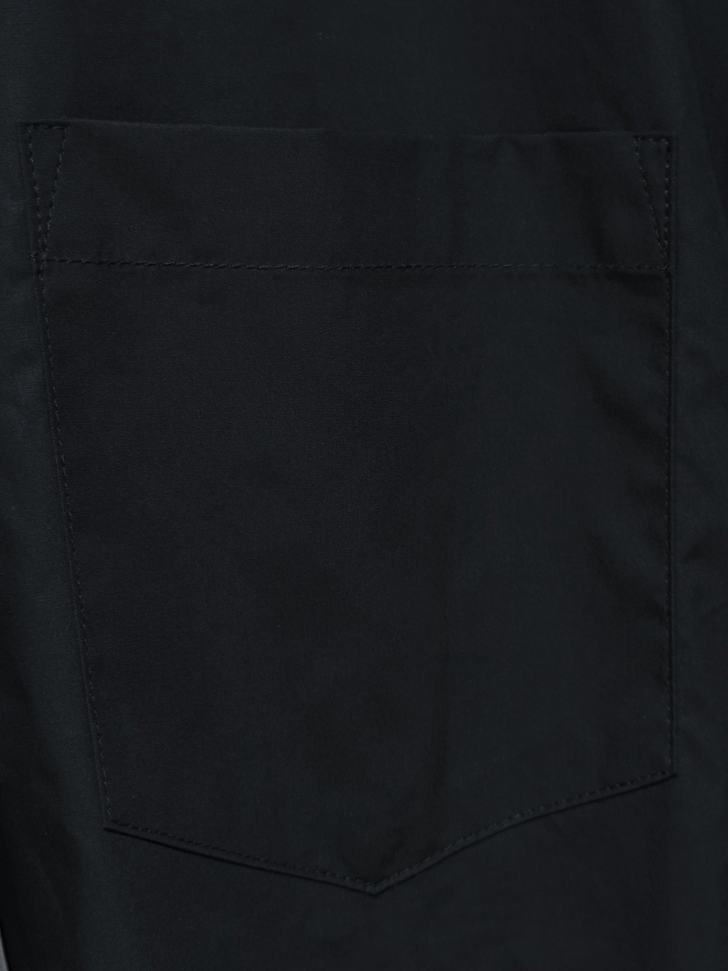 Balenciaga black chest pocket with stitched edges on a long-sleeve shirt