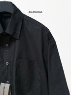 Balenciaga black long-sleeve shirt detail with chest pocket and angled seam