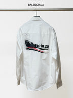 White button-up shirt with long sleeves and back graphic logo; BALENCIAGA label