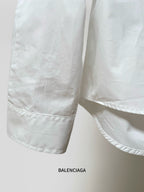 White shirt sleeve cuff with stitched hem and side seam detail