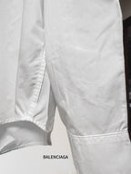 White button-up shirt bottom hem with side seam and stitched edge