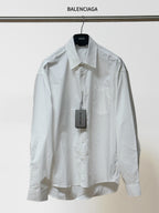 White button-up shirt with pointed collar, long sleeves, chest pocket; BALENCIAGA tag