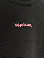 Black T-shirt close-up of pink Balenciaga logo