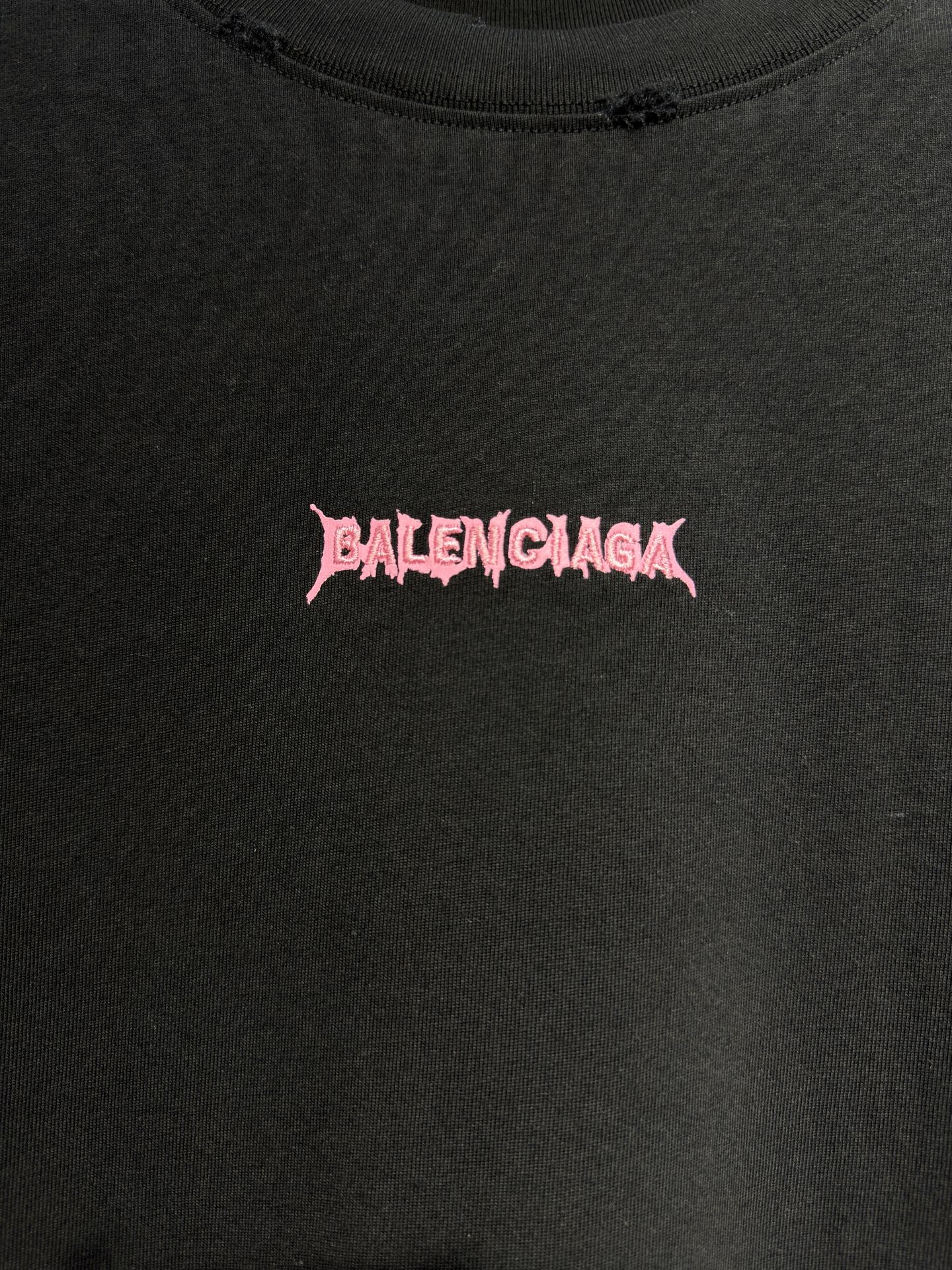Black T-shirt close-up of pink Balenciaga logo