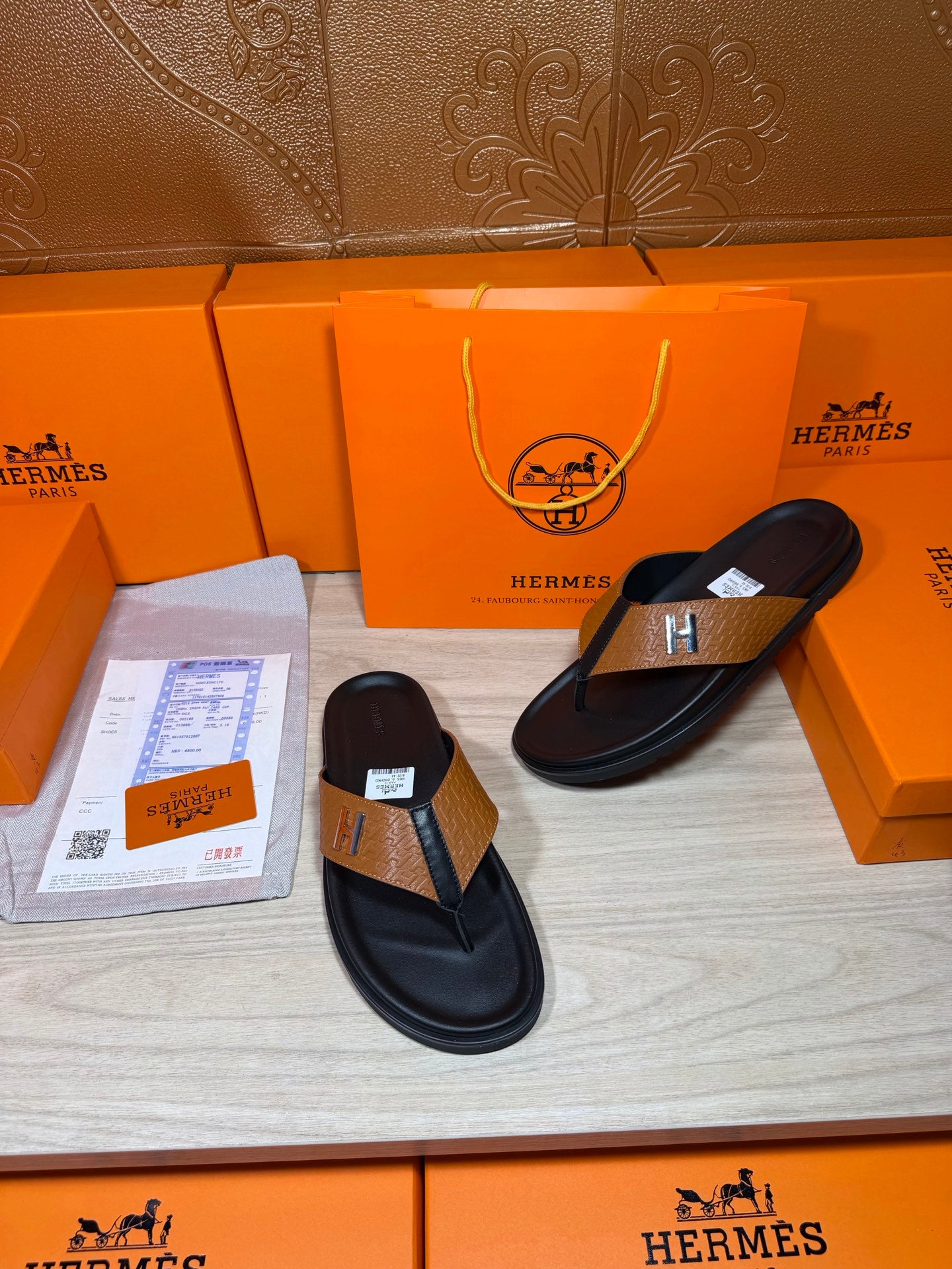 Hermes black leather thong sandals with tan strap and H logo buckle, set