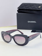 Chanel cat-eye sunglasses with dark frames and light pink tinted lenses