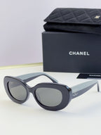 Chanel cat-eye sunglasses with gray frames and dark tinted lenses
