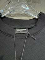 Black crewneck T-shirt collar label: Balenciaga Unisex on tag