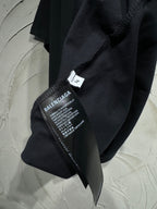 Black T-shirt with Balenciaga size and care label at side seam