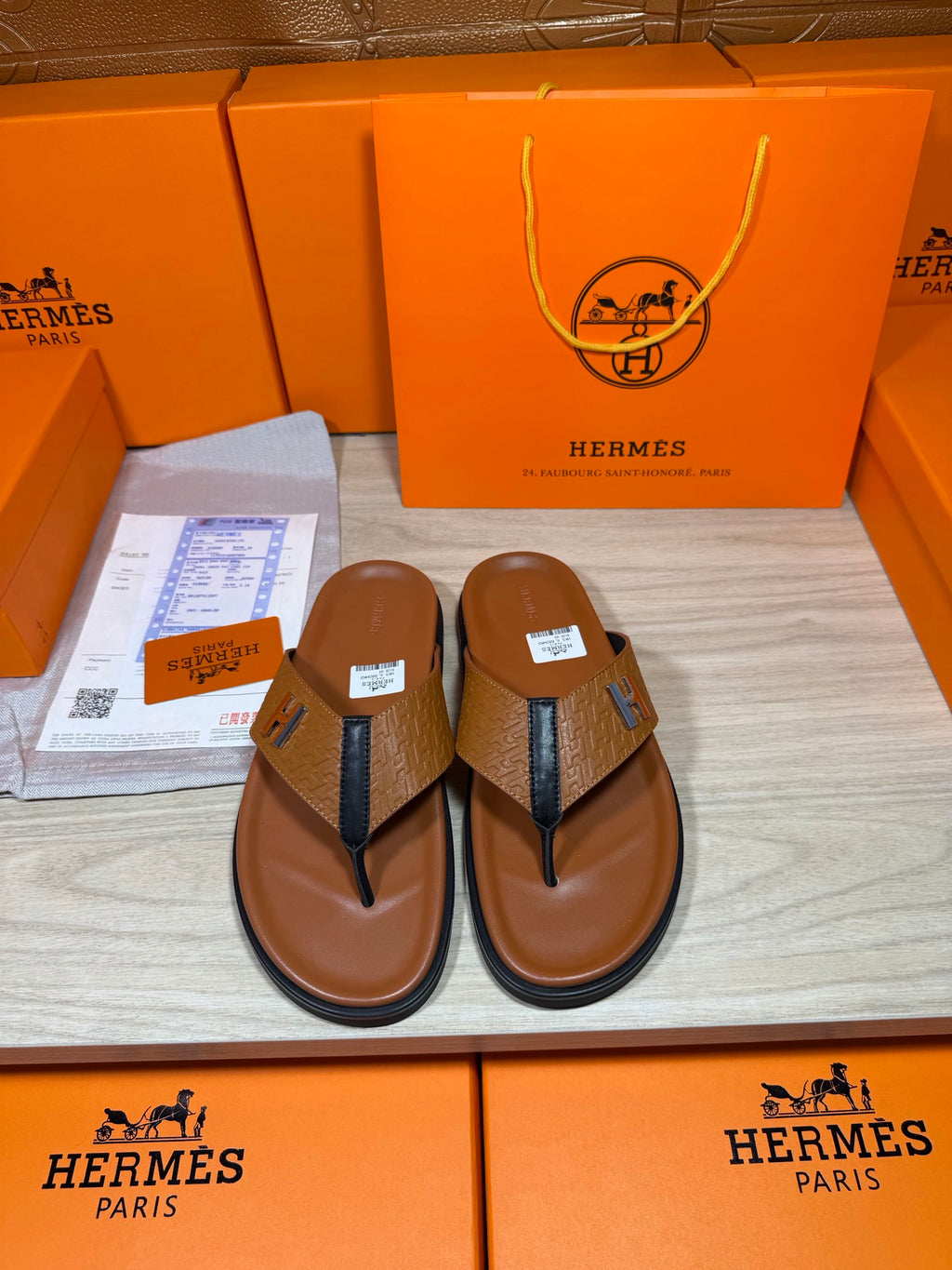 Hermes thong sandals with brown footbed, blue straps, H logo; boxed pair