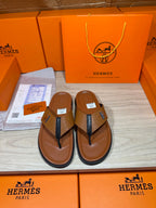 Hermes thong sandals with brown footbed, blue straps, H logo; boxed pair