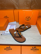 Hermes thong sandals with brown footbed and blue strap, H logo; boxed pair