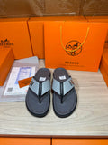Hermes flip-flop sandals, dark gray soles with gray H logo straps